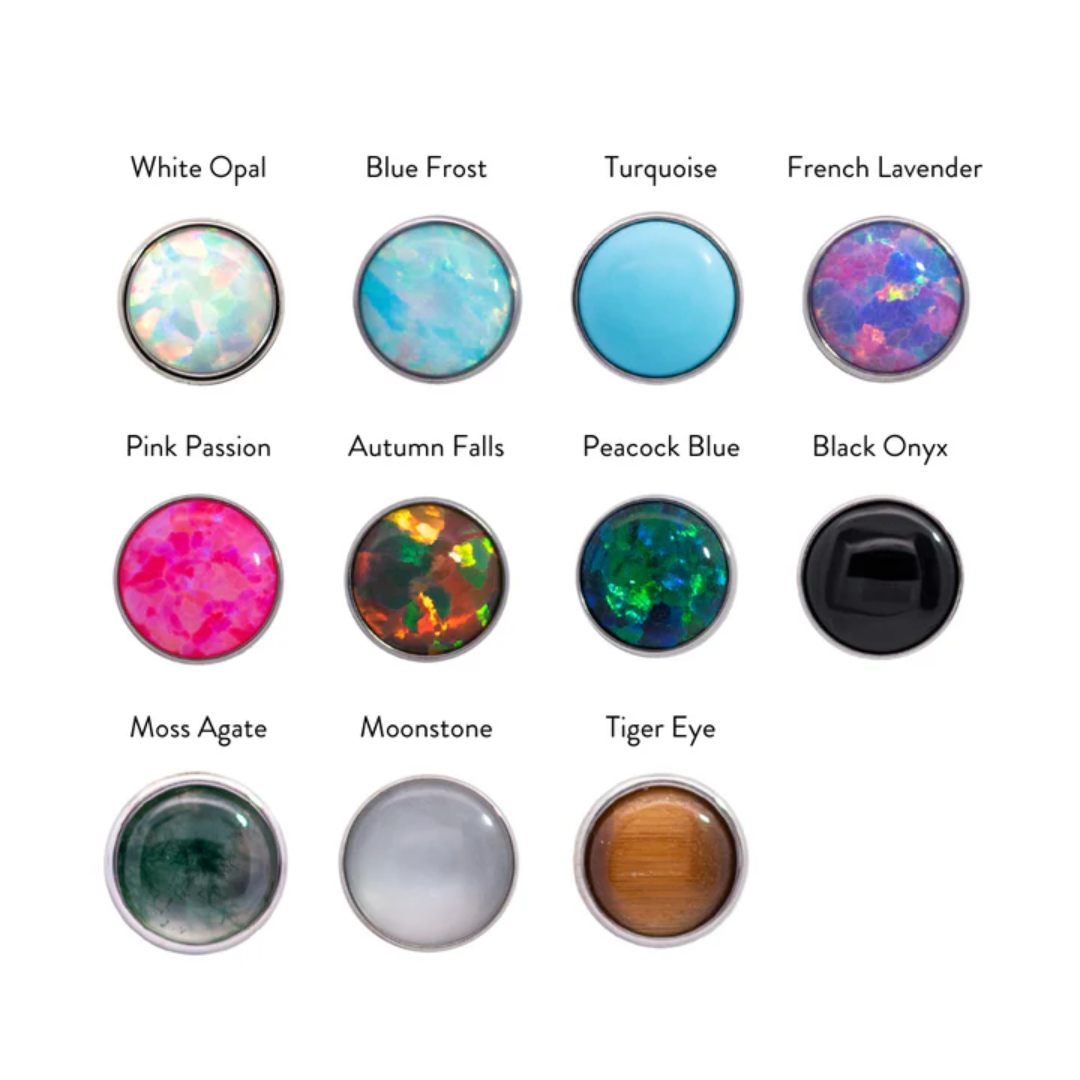 Junipurr titanium threadless cabochon end in high-polish silver, featuring a bezel-set white opal with iridescent shimmer. Also available in Blue Frost, Turquoise, French Lavender, Pink Passion, Autumn Falls, Peacock Blue, Black Onyx, Moss Agate, Moonstone, and Tiger Eye. Suitable for lip, lobe, helix, and nostril piercings.