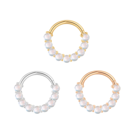 Revel clicker ring with round rainbow moonstones in yellow, white, and rose gold – luxury body jewellery for septum, daith, or conch piercings