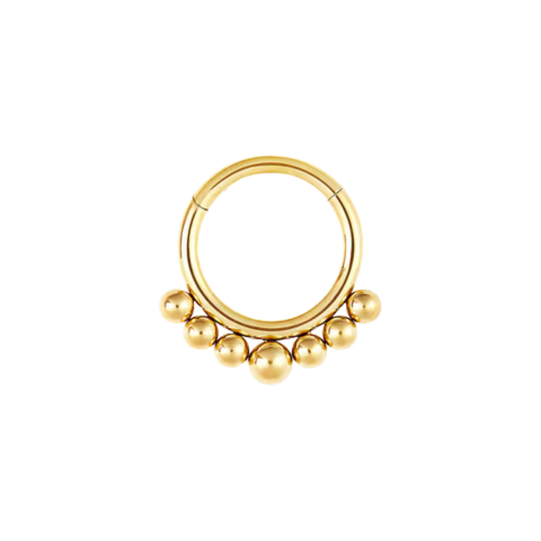 titanium clicker ring with a row of polished titanium spheres shown in polished and gold colour anodised finishes