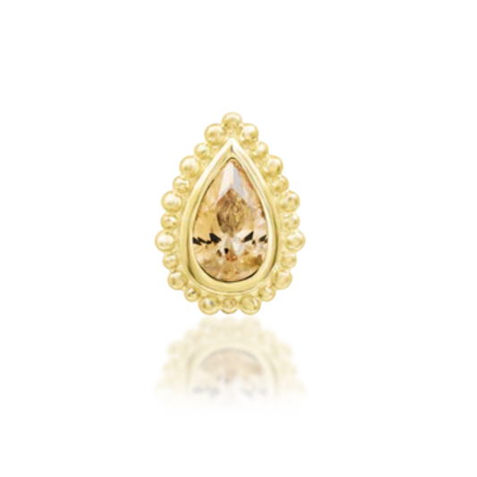 14k gold teardrop piercing with a warm champagne gemstone and decorative beaded edge