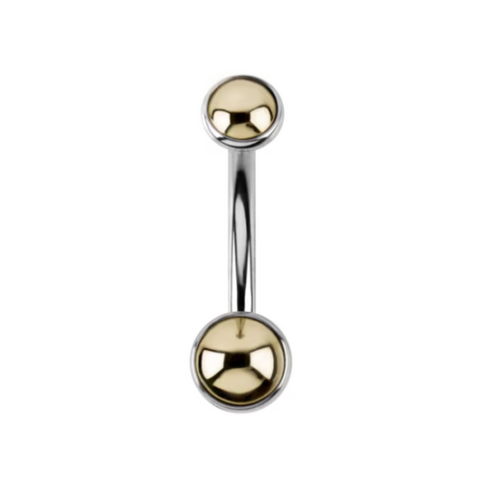 Le Roi Jewelry Doublette navel bar with yellow gold ends and titanium curved barbell