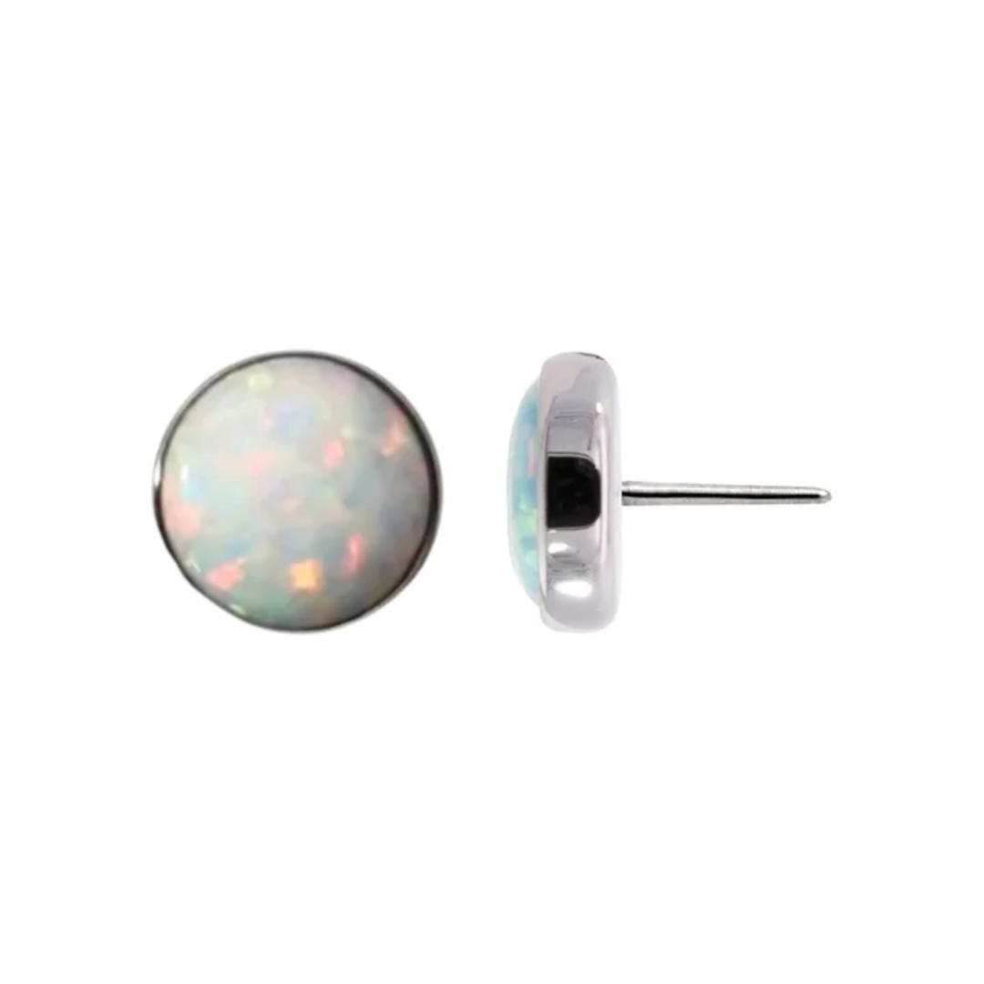Junipurr titanium threadless cabochon end in high-polish silver, featuring a bezel-set white opal with iridescent shimmer. Also available in Blue Frost, Turquoise, French Lavender, Pink Passion, Autumn Falls, Peacock Blue, Black Onyx, Moss Agate, Moonstone, and Tiger Eye. Suitable for lip, lobe, helix, and nostril piercings.