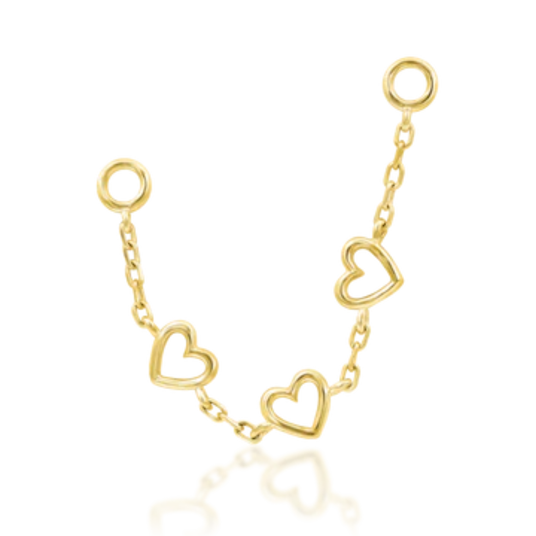 Lots of Love' 14k gold chain charm by Junipurr Jewelry featuring three open heart accents for a playful, romantic look.