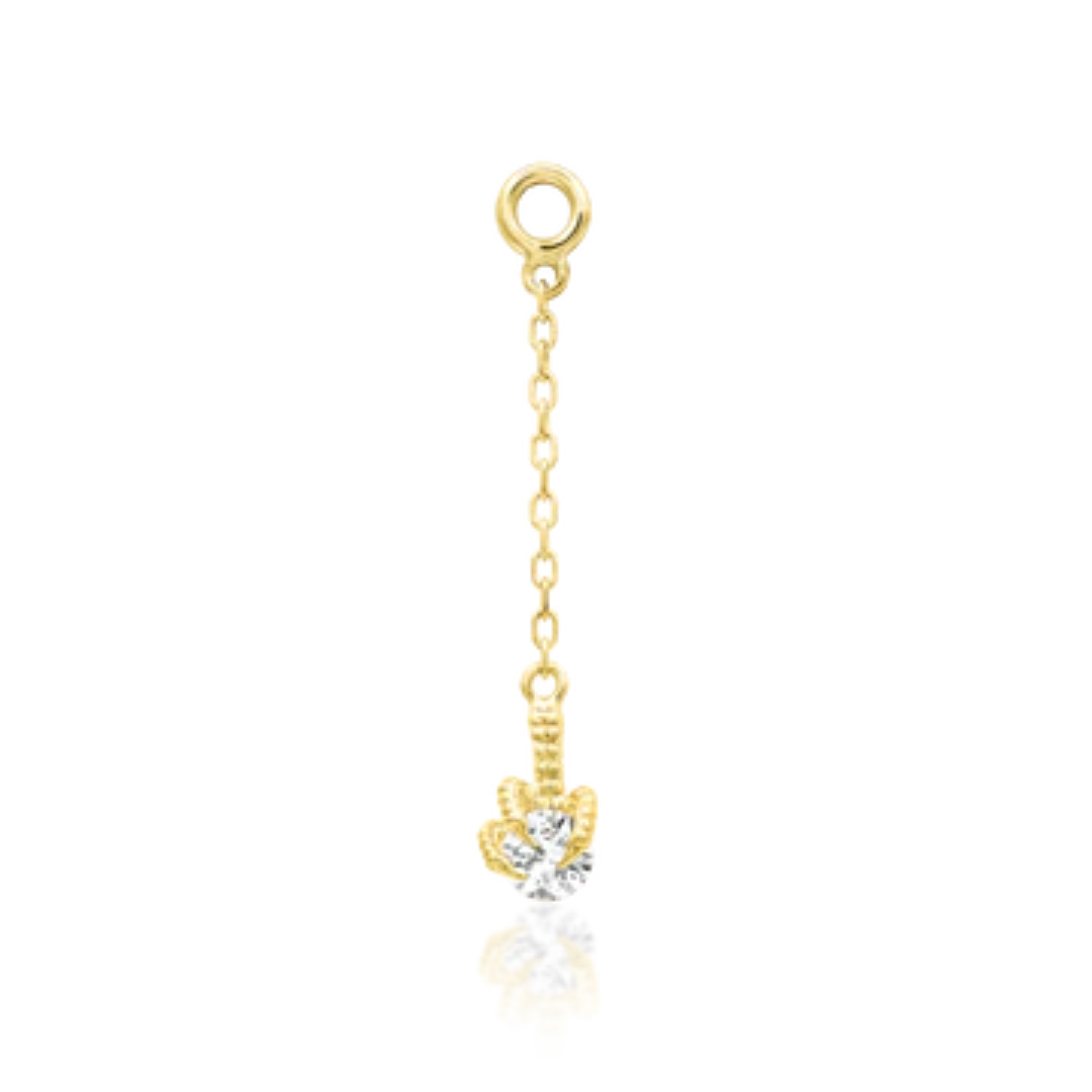 gold Nithe charm with delicate chain and cubic zirconia drop in ornate claw setting