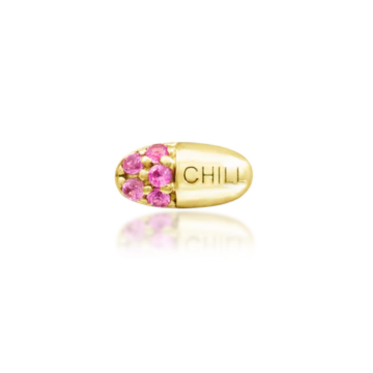 Very shiny 14k gold body jewellery in the shape of a pill engraved with “CHILL,” featuring sparkling round-cut pink cubic zirconia. A quirky, luxe accessory perfect for helix, tragus, or flat piercings