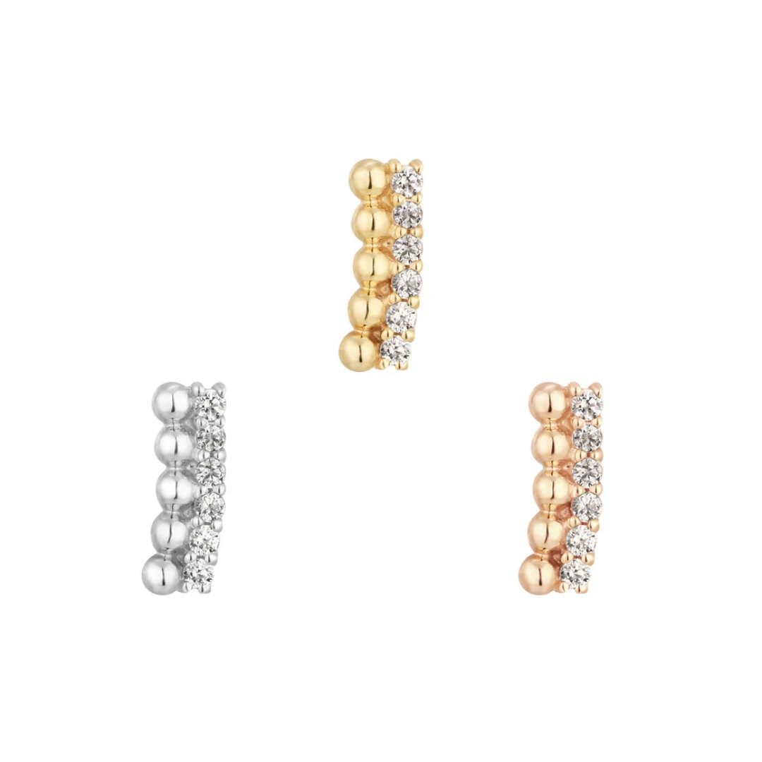 Elegant threadless end featuring a row of cubic zirconia stones set alongside polished gold or silver beads – refined luxury for curated ears