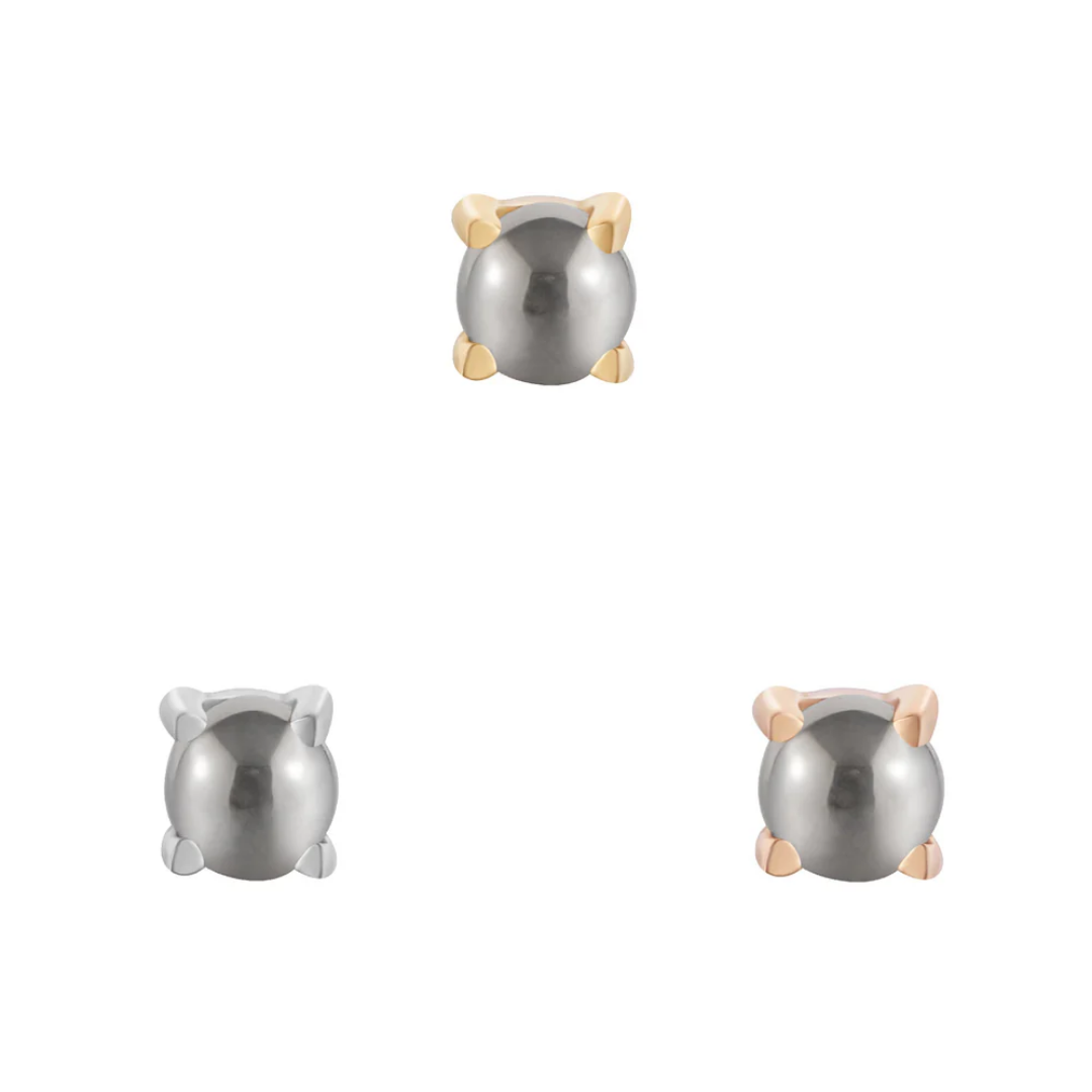 Pyrite cabochon threadless end held in 14k yellow, white, and rose gold prong settings, showcasing a bold metallic finish