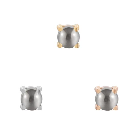 Pyrite cabochon threadless end held in 14k yellow, white, and rose gold prong settings, showcasing a bold metallic finish