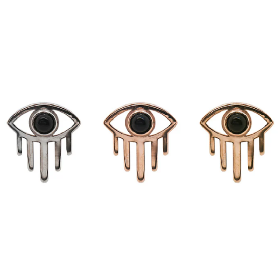 Amulet threadless ends in 14k yellow, rose, and white gold, each featuring a stylised open-eye design with a black obsidian centre stone and downward-pointing gold rays, displayed against a white background.