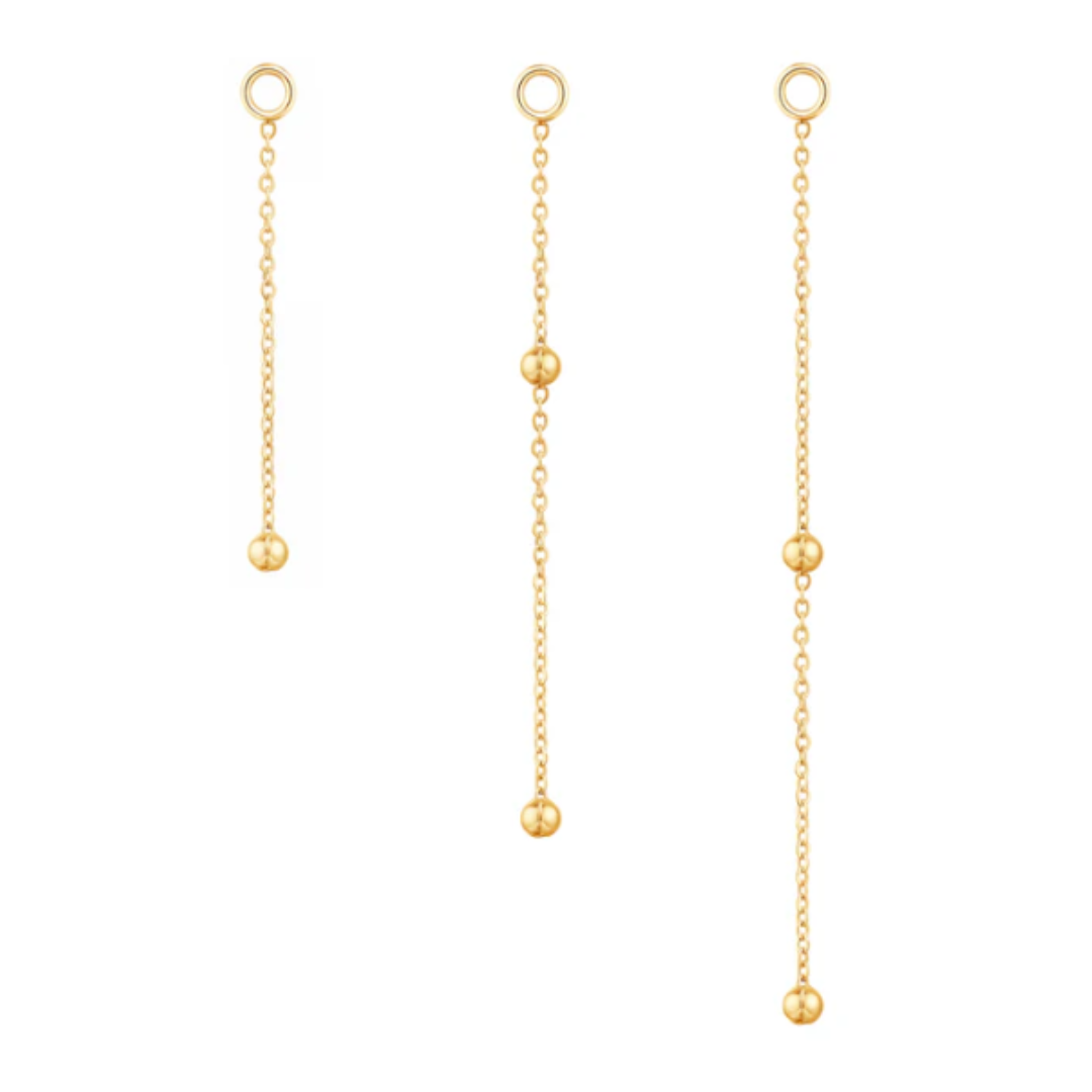 Quetzalli Cute Bead chain crafted from solid 14k gold, designed with a fine link structure and adorned with polished gold beads spaced along the length. Available in multiple lengths and gold tones, this elegant connector adds soft movement and refined texture between piercings.