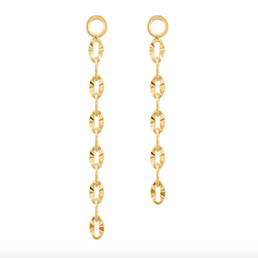 Quetzalli Diamond Cut Tail chain in solid 14k gold, designed with finely faceted oval links that reflect light for a brilliant sparkle. This elegant connector chain adds fluid motion and texture to any curated ear, available in yellow