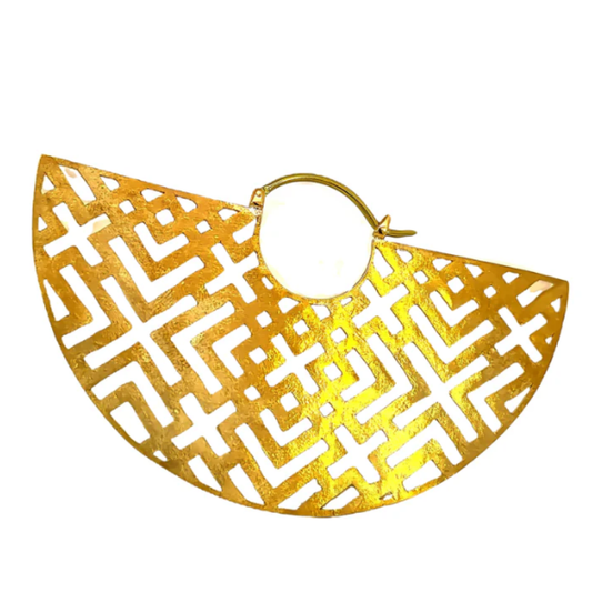 Quetzalli Hearts Talisman hoop earring crafted from yellow brass with an anodised titanium clasp, featuring a wide fan-shaped design with geometric cut-out detailing, photographed against a white background.