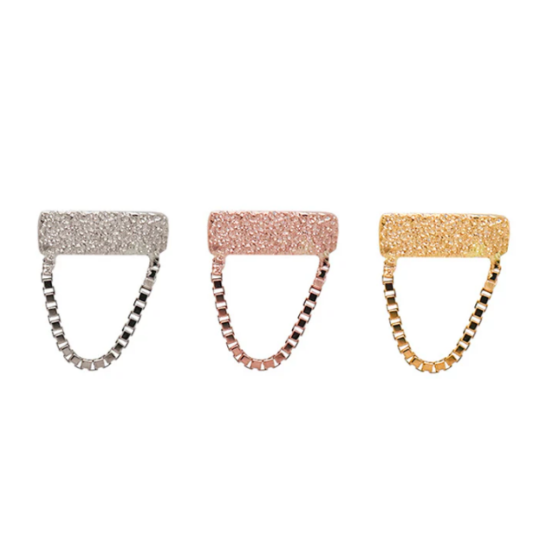 Quetzalli Swing chains in 14k yellow, rose, and white gold, each featuring a textured gold bar with a short, polished box-link chain suspended beneath, displayed on a white background.