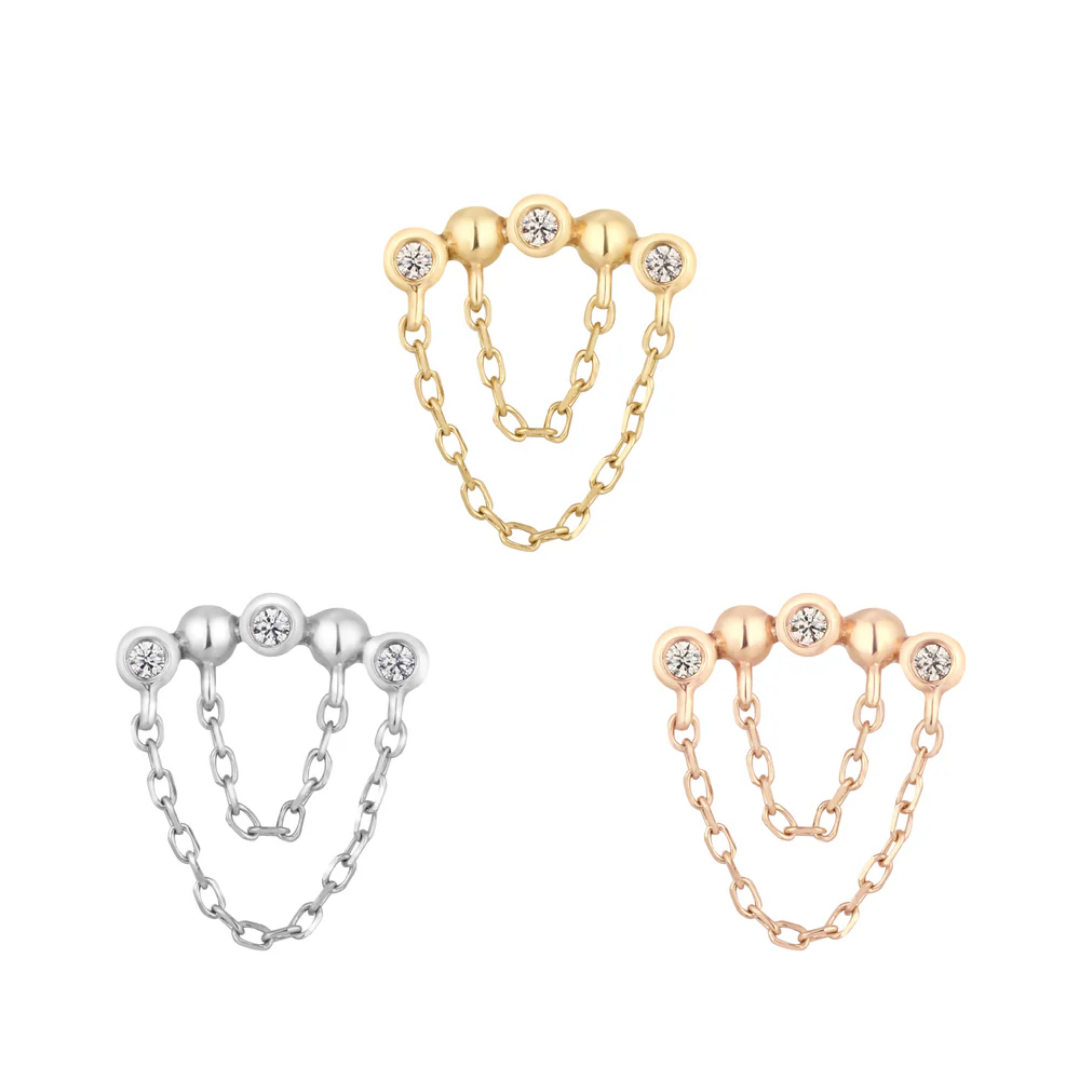 Rumors threadless end with triple bezel-set CZs and double chain detail, available in yellow, white, and rose gold.