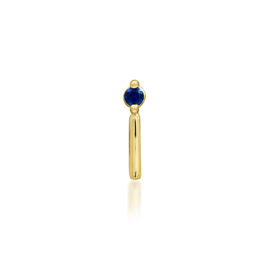14k gold piercing end featuring a deep blue round-cut cubic zirconia stone with a sleek vertical gold bar accent
