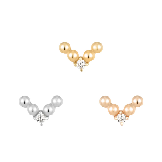 Gold V-shaped threadless end adorned with polished gold beads and a central clear CZ stone, perfect for stacked or solo lobe and helix piercings