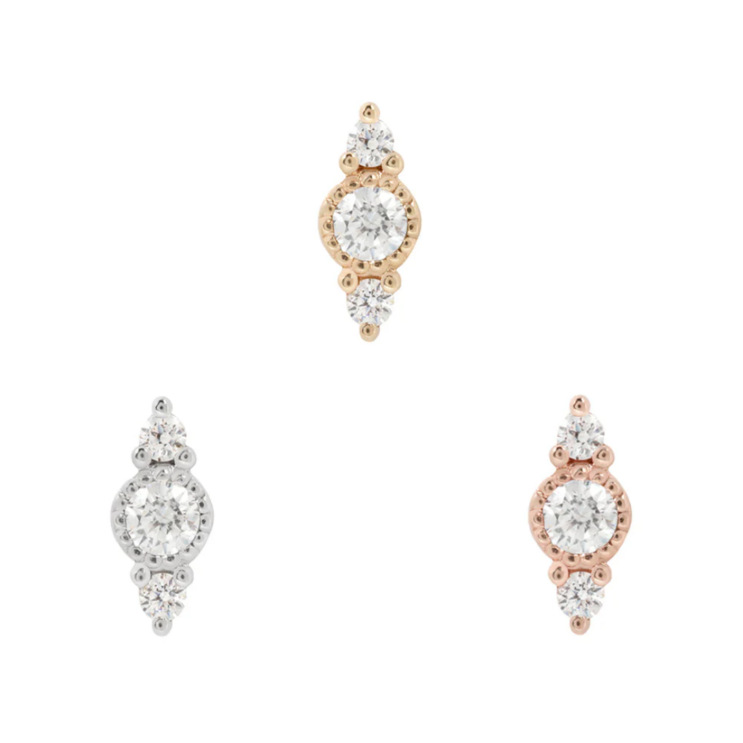 Elegant threadless ends featuring a central brilliant-cut CZ with beaded detailing and two accent CZs, available in yellow, white, and rose gold.