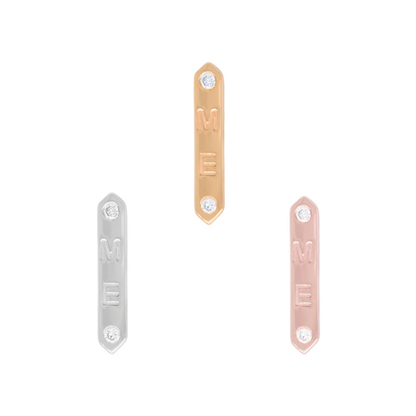 Vertical gold bar threadless end engraved with “ME”, accented by two bezel-set diamonds at top and bottom, available in yellow, rose, and white gold.