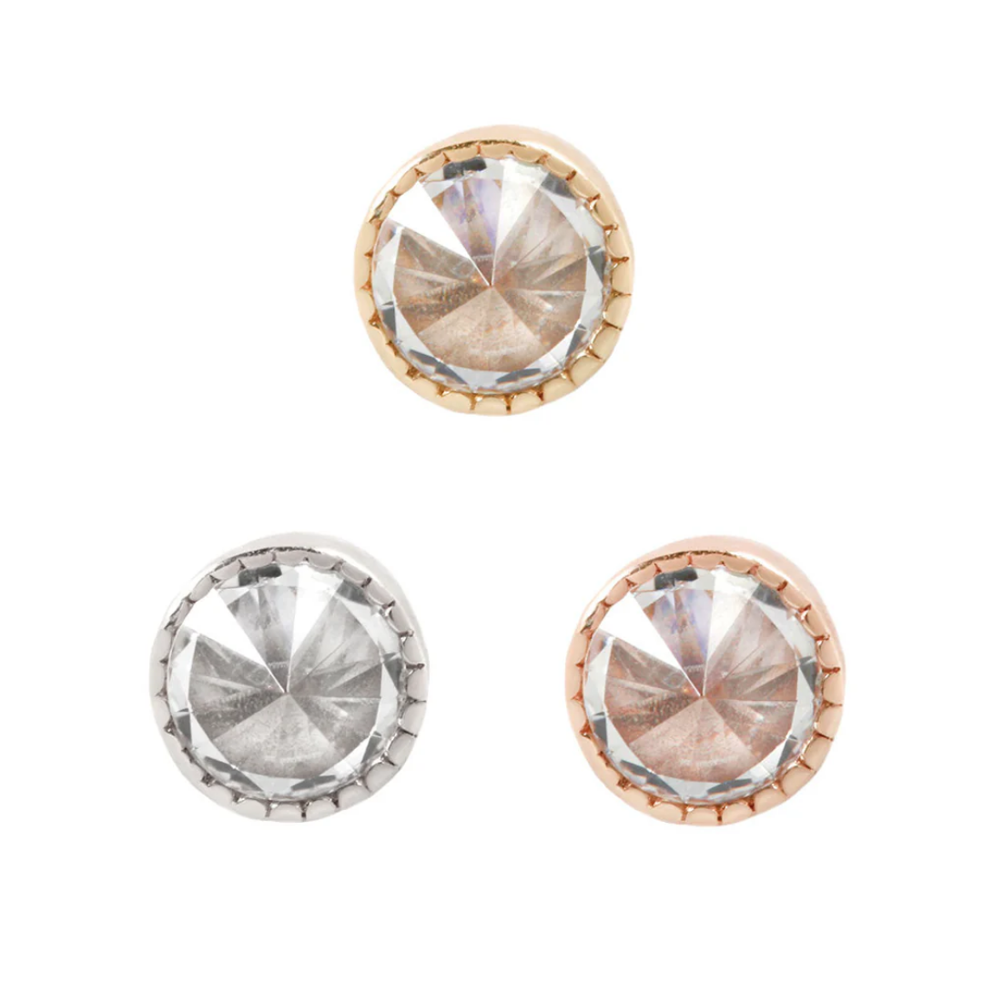 Milgrain reverse set CZ threadless end in gold, rose gold, and white gold, featuring a bold faceted cubic zirconia framed by delicate beaded milgrain detailing.