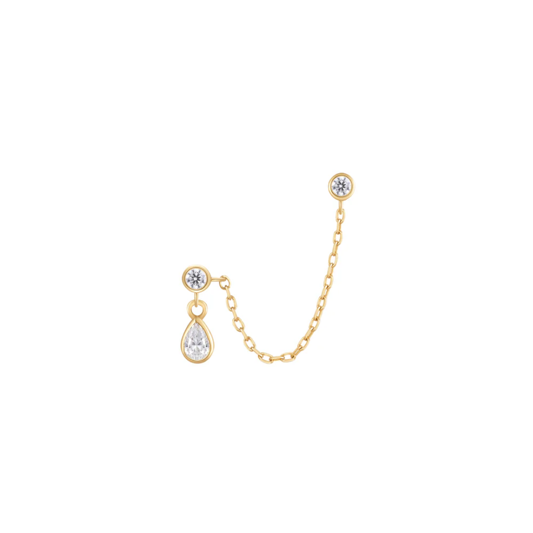 Mischief threadless end in gold featuring a clear CZ teardrop dangle, two bezel-set CZs, and a delicate connecting chain