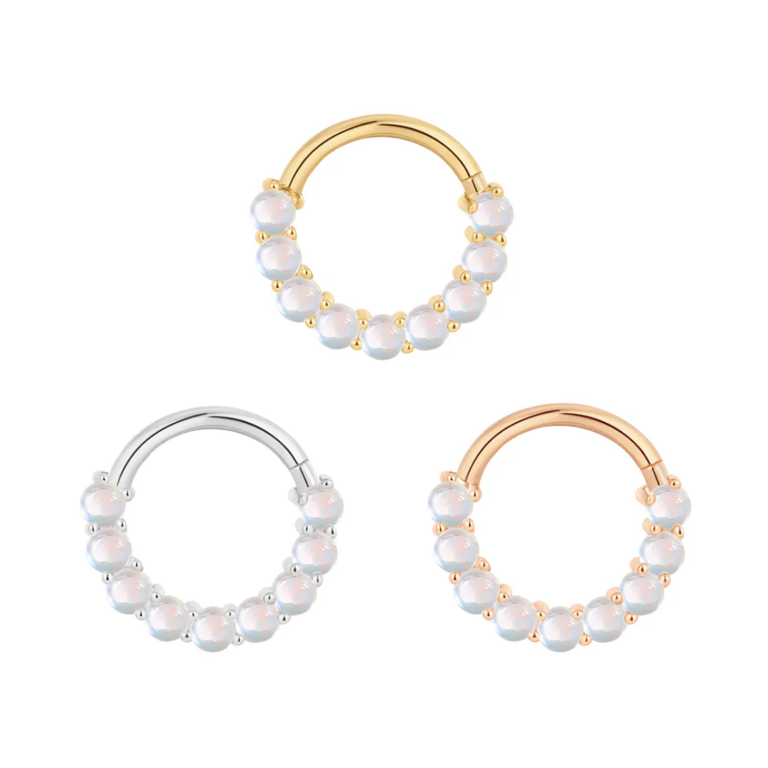 Revel clicker ring with round rainbow moonstones in yellow, white, and rose gold – luxury body jewellery for septum, daith, or conch piercings
