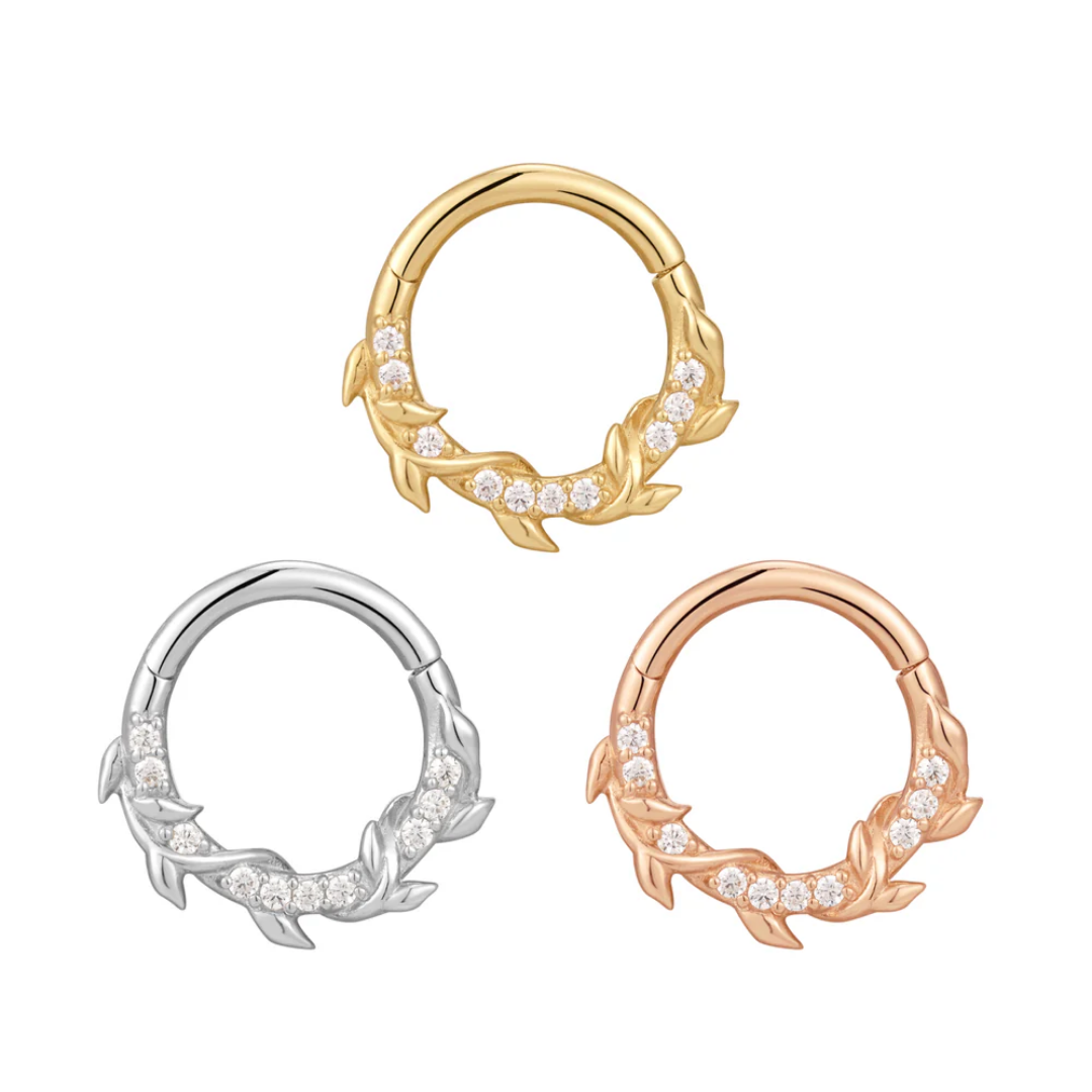 Wild Hearts clicker ring with cubic zirconia and leaf design in yellow, white, and rose gold – nature-inspired luxury body jewellery for septum, daith, or helix piercings