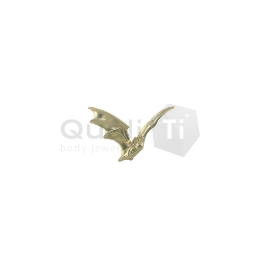 14k yellow gold threadless attachment shaped like a flying bat with detailed wings and facial features, suitable for lobe, helix, or flat piercings.