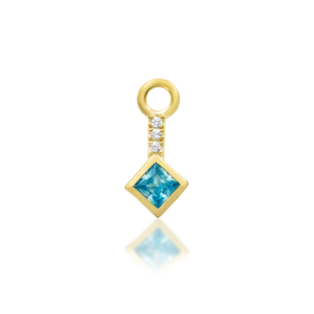 gold dangle charm featuring square-cut blue topaz and pavé CZ detail, luxury piercing jewellery