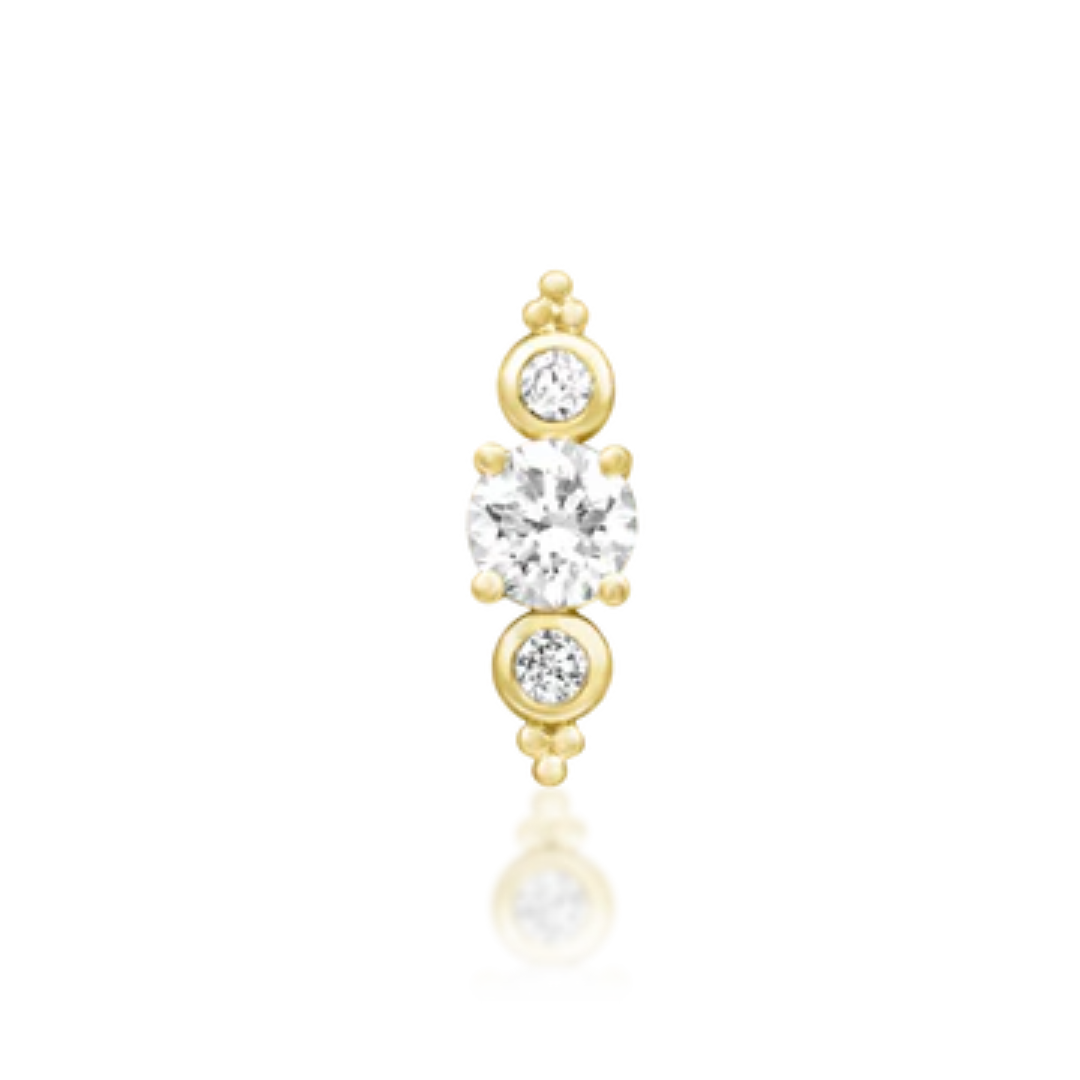 Very shiny 14k gold body jewellery featuring three brilliant white diamond stones with delicate beaded accents. A radiant vertical stud ideal for lobe, helix, or flat piercings