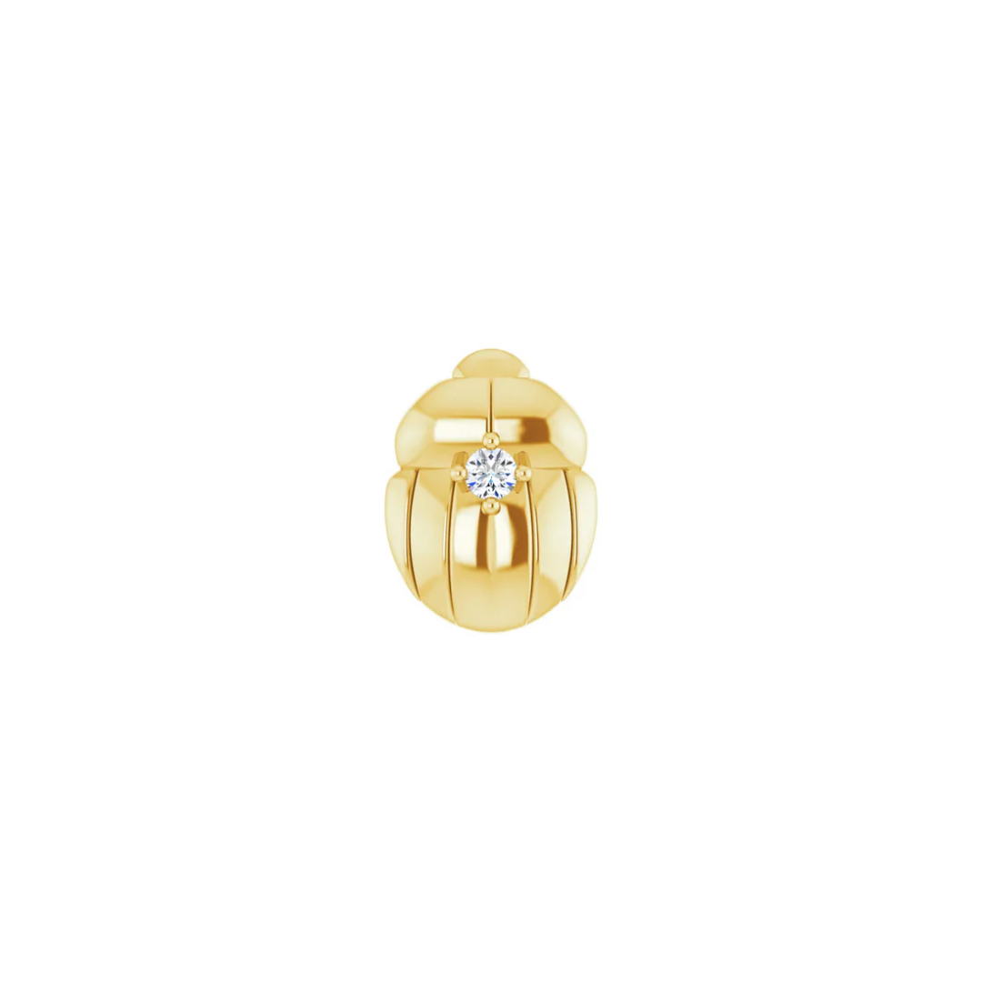 gold norvoch beetle shaped piercing end with a single centre gemstone in a polished sculpted design