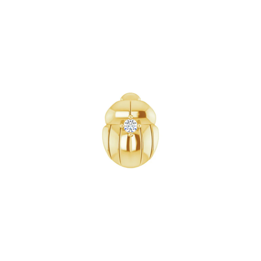 gold norvoch beetle shaped piercing end with a single centre gemstone in a polished sculpted design