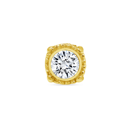 Close-up of a Norvoch gold square bezel-set piercing end featuring a round brilliant-cut cubic zirconia framed by textured gold detailing