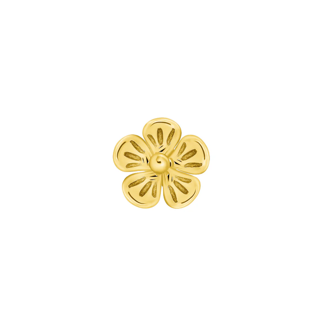 Close-up of a Norvoch gold flower end with five softly curved petals and intricate cut-out detailing, crafted in polished yellow gold