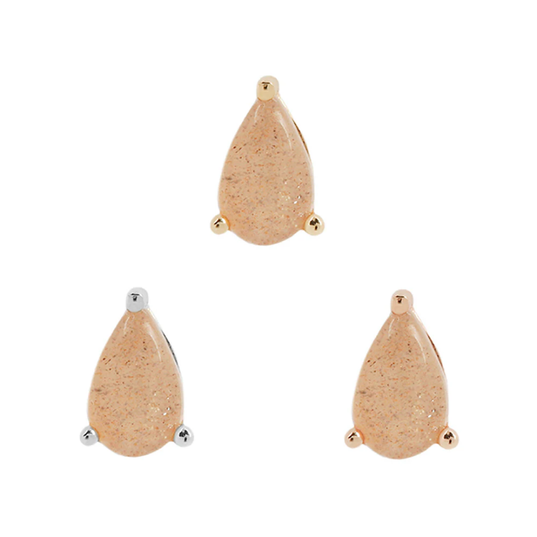 Teardrop-shaped sunstone threadless end in gold, silver, and rose gold prong settings, shimmering with subtle coppery tones.