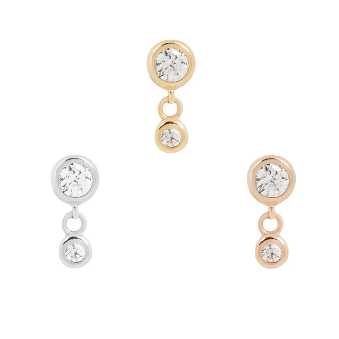 Gold threadless end with two bezel-set clear CZs, one fixed and one delicately dangling beneath