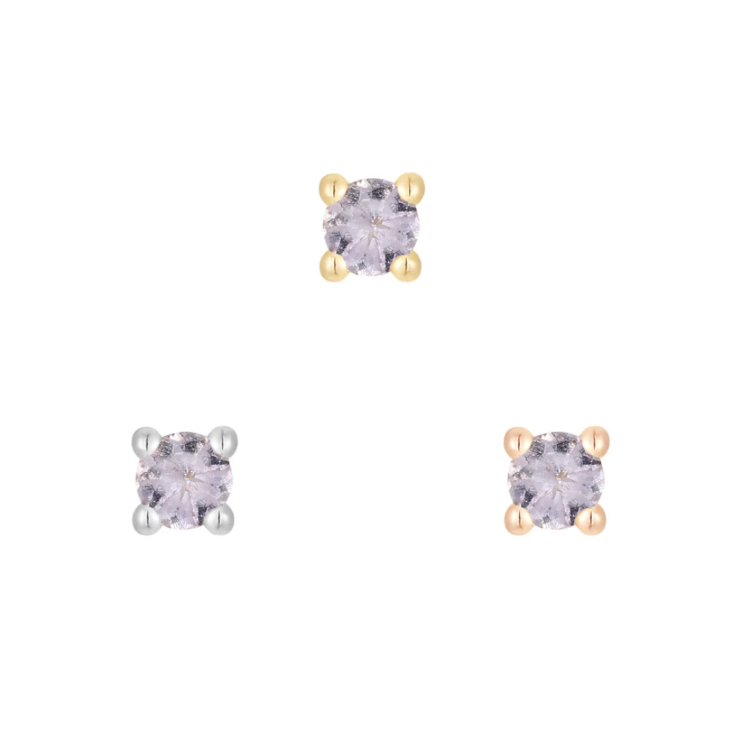 Gold threadless end featuring a round-cut tanzanite gemstone in a classic four-prong setting.