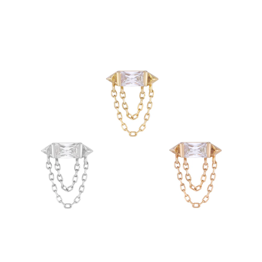 Gold threadless end with a rectangular cubic zirconia and dual gold chain accents for a modern, edgy look.
