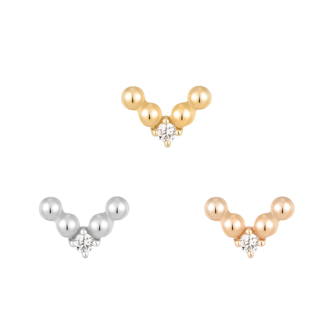 Gold V-shaped threadless end adorned with polished gold beads and a central clear CZ stone, perfect for stacked or solo lobe and helix piercings