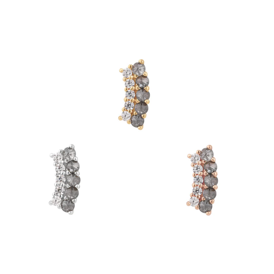 Gold Whisper + Shout threadless end featuring a striking row of grey diamonds with offset white CZ accents, perfect for a unique lobe or helix piercing