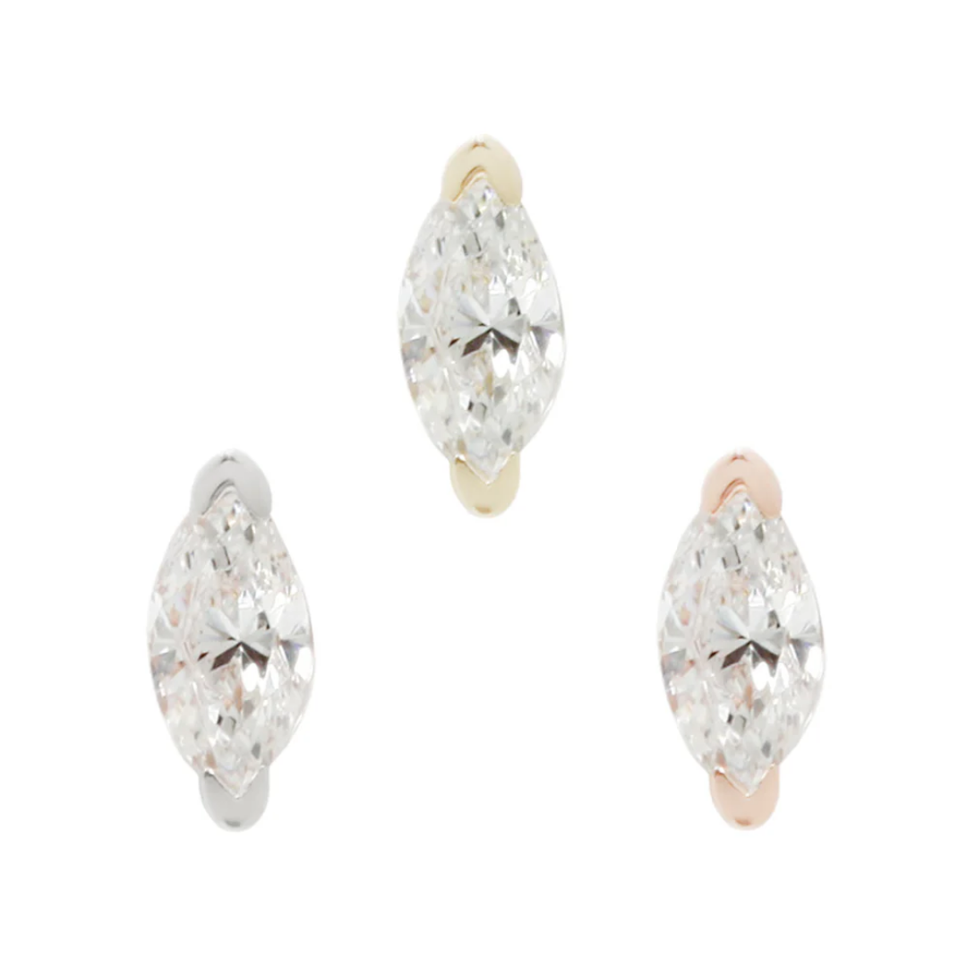 Zuri threadless end in yellow, white, and rose gold with marquise-cut cubic zirconia in a minimalist setting.